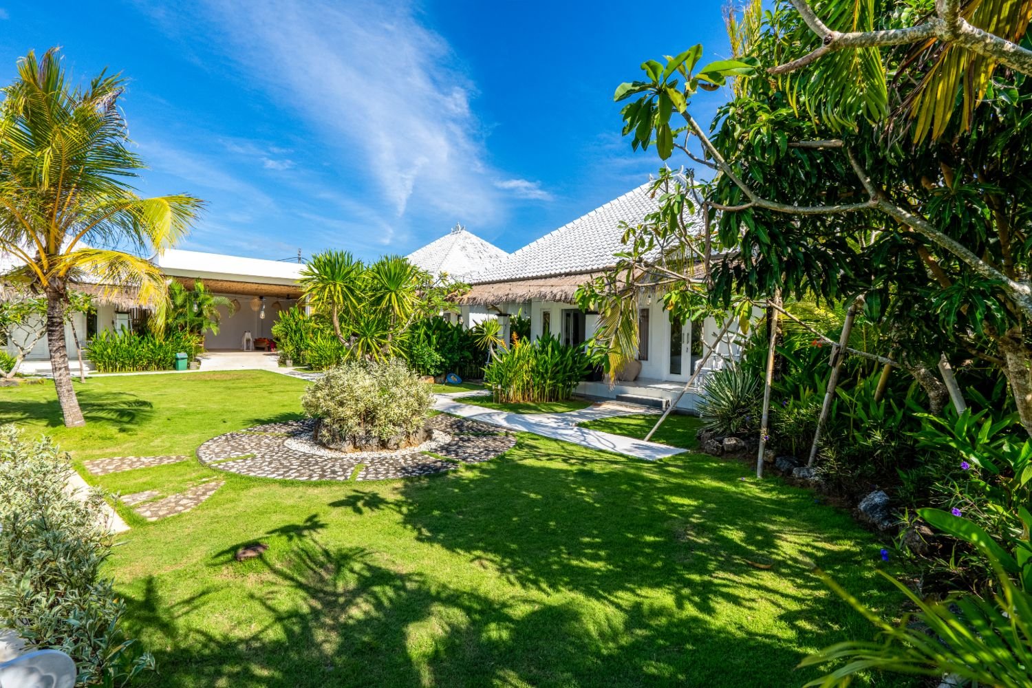 Tropical gardens and villa exterior